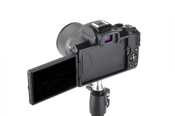 Black and Modern digital mirrorless Camera with lens on white background.