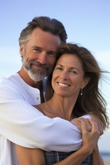 Fototapeta premium Happy middle-aged couple smiling outdoors