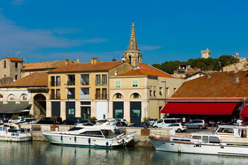 View of bay with boats and old houses of Beaucaire, France