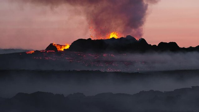 Volcano eruption, close up of exploding and spewing lava of volcano crater, active volcano in Iceland