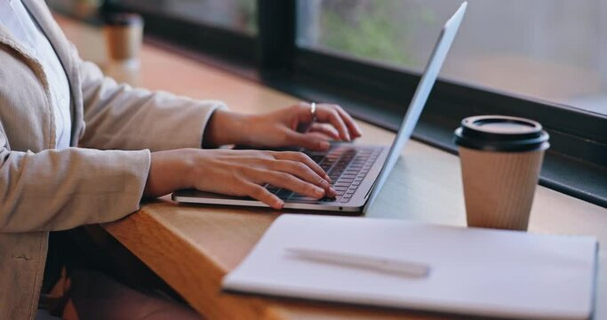 Woman, coffee shop and typing on laptop, hands and remote work for business, write email and journalist. Businesswoman, employee and technology for writing career, copywriter or working as creative