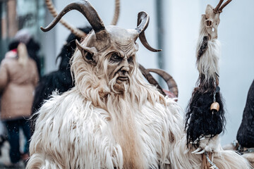 Krampus monster costumes on street background.Carnival processions in Germany.Carnival costumes and...