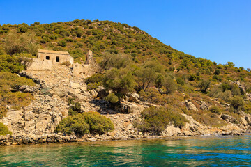 Naklejka premium Antique ruins of an ancient city on the island. Background with selective focus and copy space