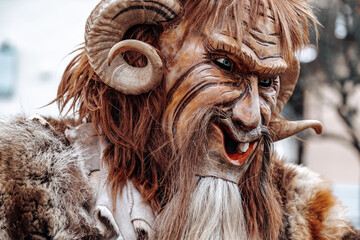 Krampus monster costume.Carnival processions in Germany.Carnival costumes and characters.Winter costume processions on the streets of Europe.Traditional cultural folklore festival  - obrazy, fototapety, plakaty