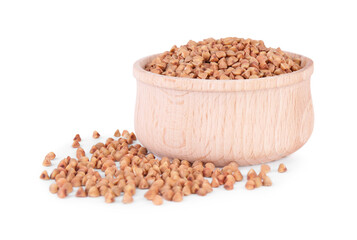 Dry buckwheat in wooden bowl isolated on white