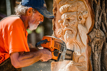 Chainsaw carving artistry, a creative image featuring an artist using a chainsaw to intricately carve a sculpture from a tree trunk. - obrazy, fototapety, plakaty