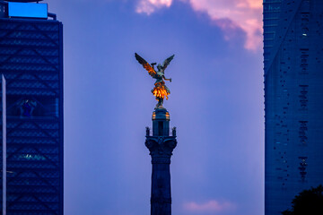 Low angle of famous The Angel of Independence statue located in downtown of Mexico city against...