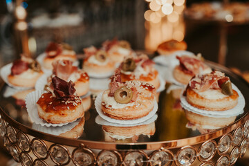 several snacks on a table, at a luxurious party