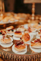 several snacks on a table, at a luxurious party