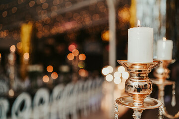 luxurious party illuminated by chandeliers with candles
