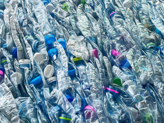 blue plastic bottles with a recycling symbol