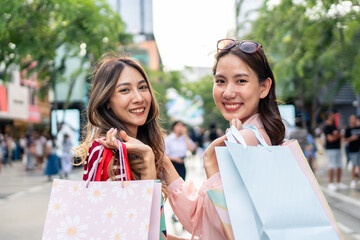 Portrait of Asian women shopping goods outdoor in department store. 