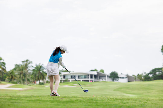 Professional woman golfer practice in golf course