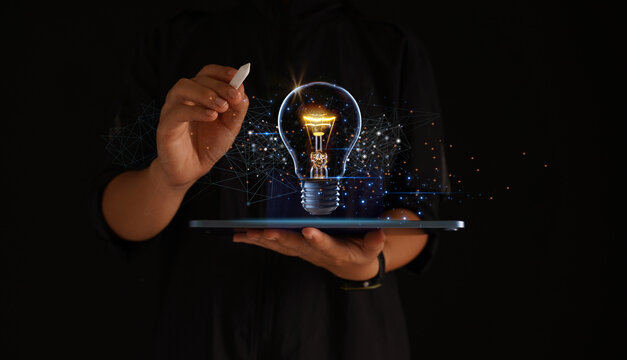 Creative solutions or ideas for designing innovative web banners or hand-drawn landing page templates coming out of tablet screens with colorful abstract geometric bulbs and leading lines.