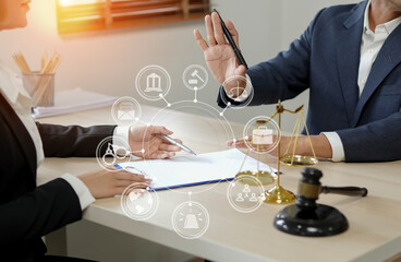 judge on wooden table And experienced lawyers meet with clients and give advice behind the scenes. legal services legal consulting concept
