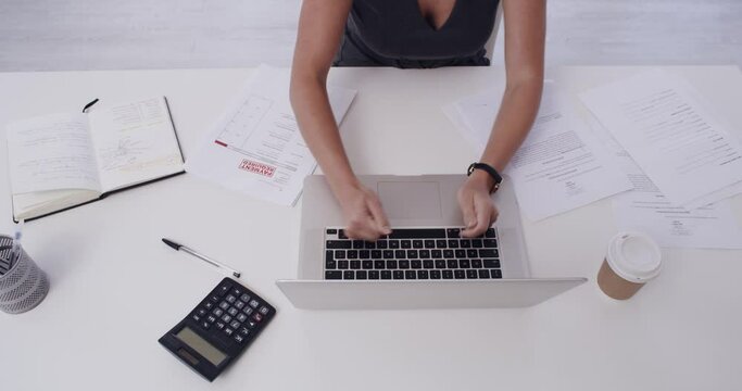 Hands of woman, smashing or fists on laptop with stress, mistake or burnout in office. Top, fail or frustrated accountant hitting keyboard on technology for anger, glitch error or disaster breakdown