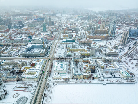 Embankment of the central pond and Plotinka in Yekaterinburg at winter sunset. The historic center of the city of Yekaterinburg, Russia, Aerial View