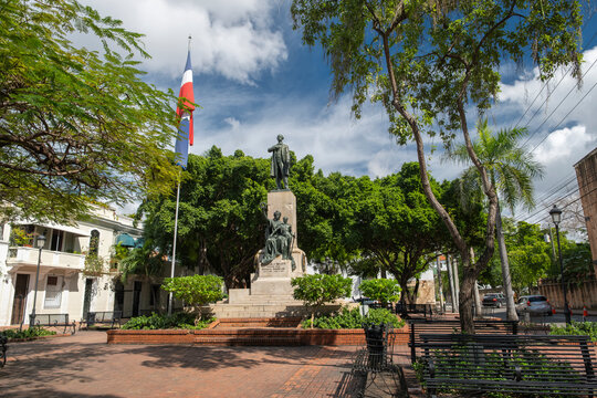 Statue of Juan Pablo Duarte nation's founding father and country's flag in a city park in colonial zone of the historic city center of Santo Domingo, Dominican Republic.   