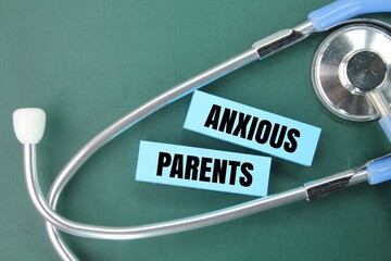 stethoscope and colored paper with words of anxious parents