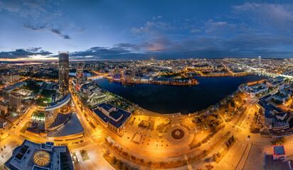 Yekaterinburg city and pond aerial panoramic view at summer or early autumn night. Night city in...