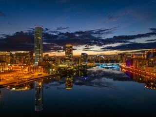 Yekaterinburg city and pond aerial panoramic view at summer or early autumn night. Night city in the early autumn or summer.