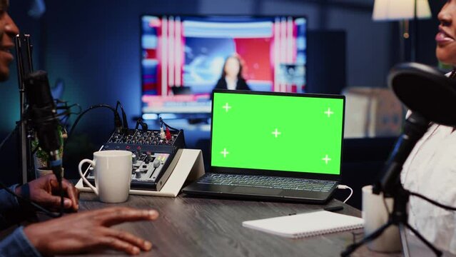 Isolated screen laptop next to analog mixer used by show host recording podcast in studio. Chroma key notebook near man professional audio device in live broadcast ensuring flawless sound quality