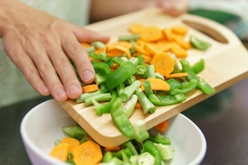 Colorful view of pieces of vegetables on a cutting board
