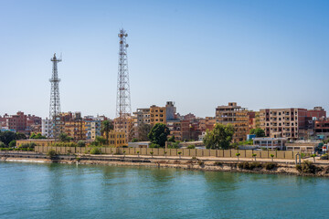 City along the Suez Canal in Egypt with the water in the foreground