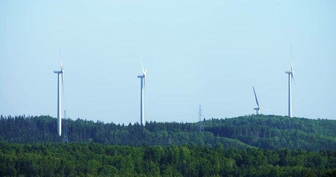 Windmill turbine on hill / Matane
