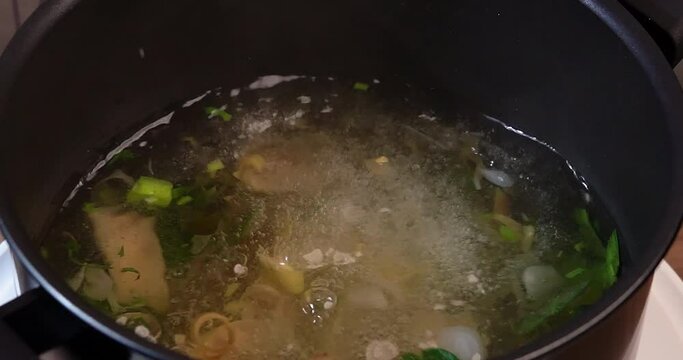 Slow Motion, Adding herbs and ingredients into clear tom yum soup, such as lemongrass, onion, kaffir lime leaves, galangal, parsley, cooking clear tom yum soup