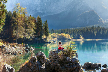 Adult Woman Meditation in Natural Environment of an Autumn Alpine Lake