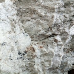 Stone wall background texture .Cracked white beautiful stone texture.