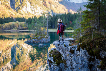 Discovery Hike for an Adult Female Backpacker in the Scenic Alpine Environment of a Mountain Lake