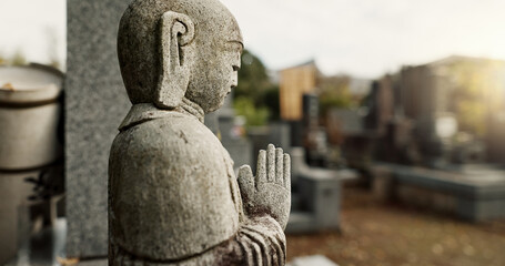 Japan, prayer hands and buddhist stone statue at graveyard for spiritual religion in Tokyo. Jizo,...