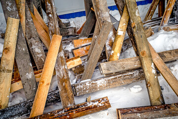 Details of a wooden fence on a winter day