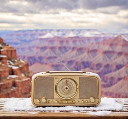 Vintage radio on wooden table with Grand Canyon National Park, Arizona, USA