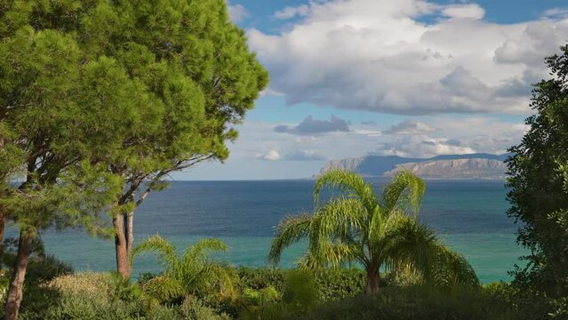 Landscape with green trees, sea and mountains of western Sicily, near Palermo, Italy. Nature of Sicily