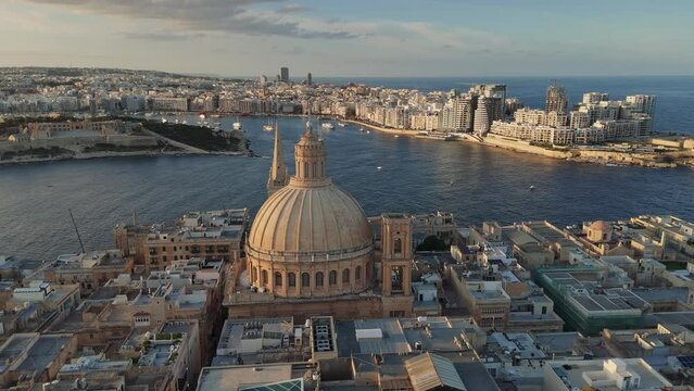 Flying over Valletta city, Malta. View to Sliema area. Aerial shot of Valletta old town in Malta