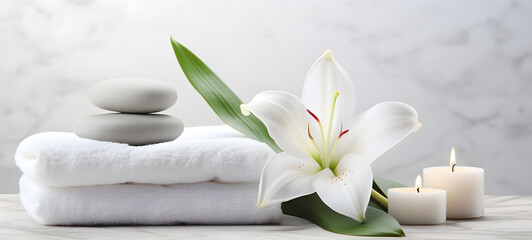 Fototapeta na wymiar Folded White towels with white lily flower on white table, Beauty spa and Fashion cocept with copy space for mock up product.