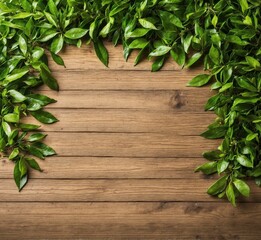 Obraz premium Wooden background with green leaves. Top view with copy space.