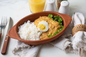 Aji de gallina chicken spicy cream served with rice traditional peruvian food