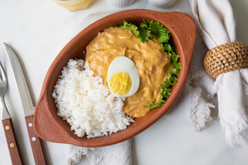 Aji de gallina chicken spicy cream served with rice traditional peruvian food