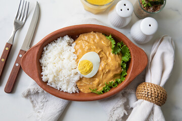Aji de gallina chicken spicy cream served with rice traditional peruvian food