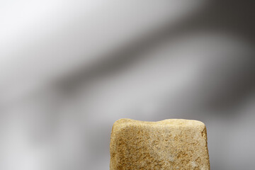 Stone podium mockup against gray background copy space