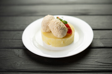 Traditional russian cuisine, chicken cutlet, mashed potatoes and vegetables on a plate in a cafe