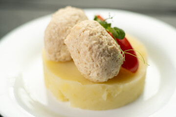 Healthy chicken cutlets from minced meat with mashed potato and vegetables in restaurant