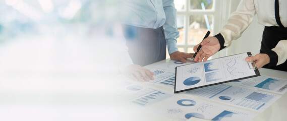 Businesspeople evaluate project efficiency and financial figures with business team for marketing...