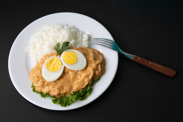 Aji de gallina chicken spicy cream served with rice traditional peruvian food
