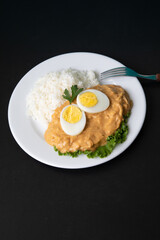 Aji de gallina chicken spicy cream served with rice traditional peruvian food