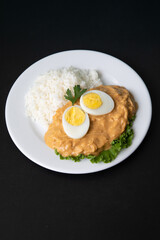 Aji de gallina chicken spicy cream served with rice traditional peruvian food